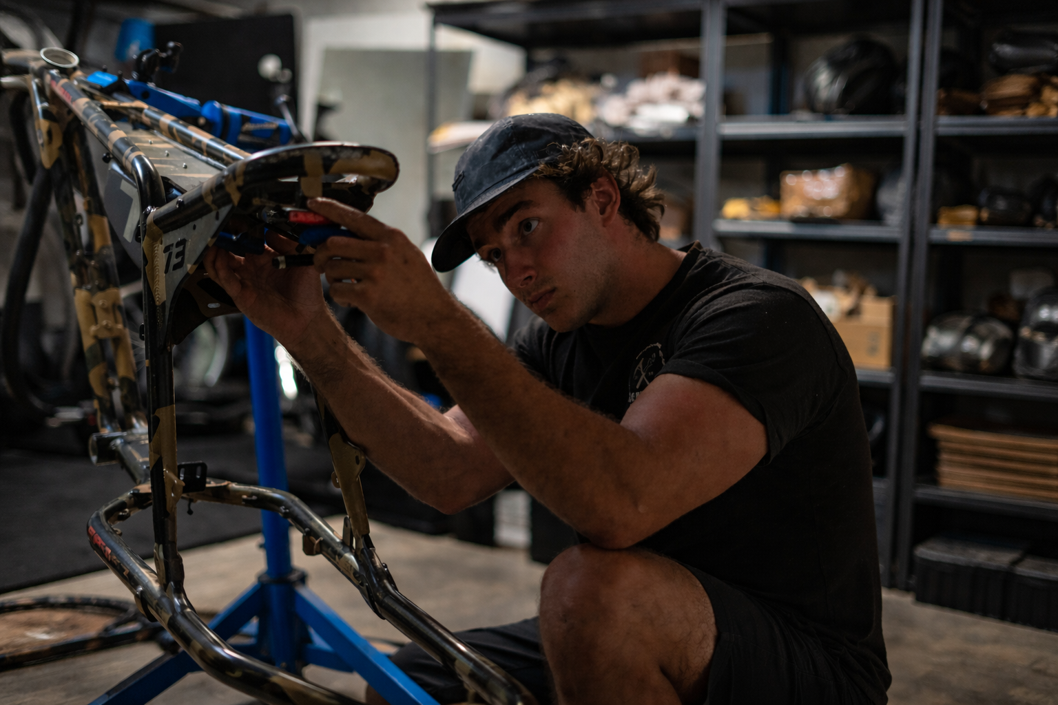 Certified mechanic working on a bike frame